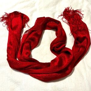 Bright red shimmery scarf/wrap with end fringe.